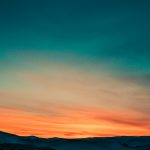 Sunset over snow covered mountains I hate dusk