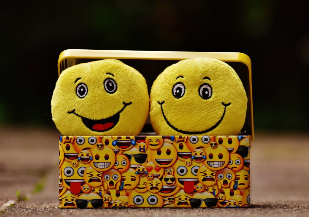 Two yellow emoji on yellow case