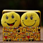 Two yellow emoji on yellow case